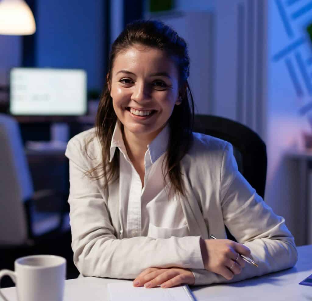 Close up portrait of business woman smiling at camera